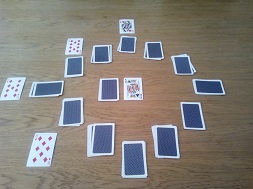 A game of clock solitaire mid-game with cards turned over